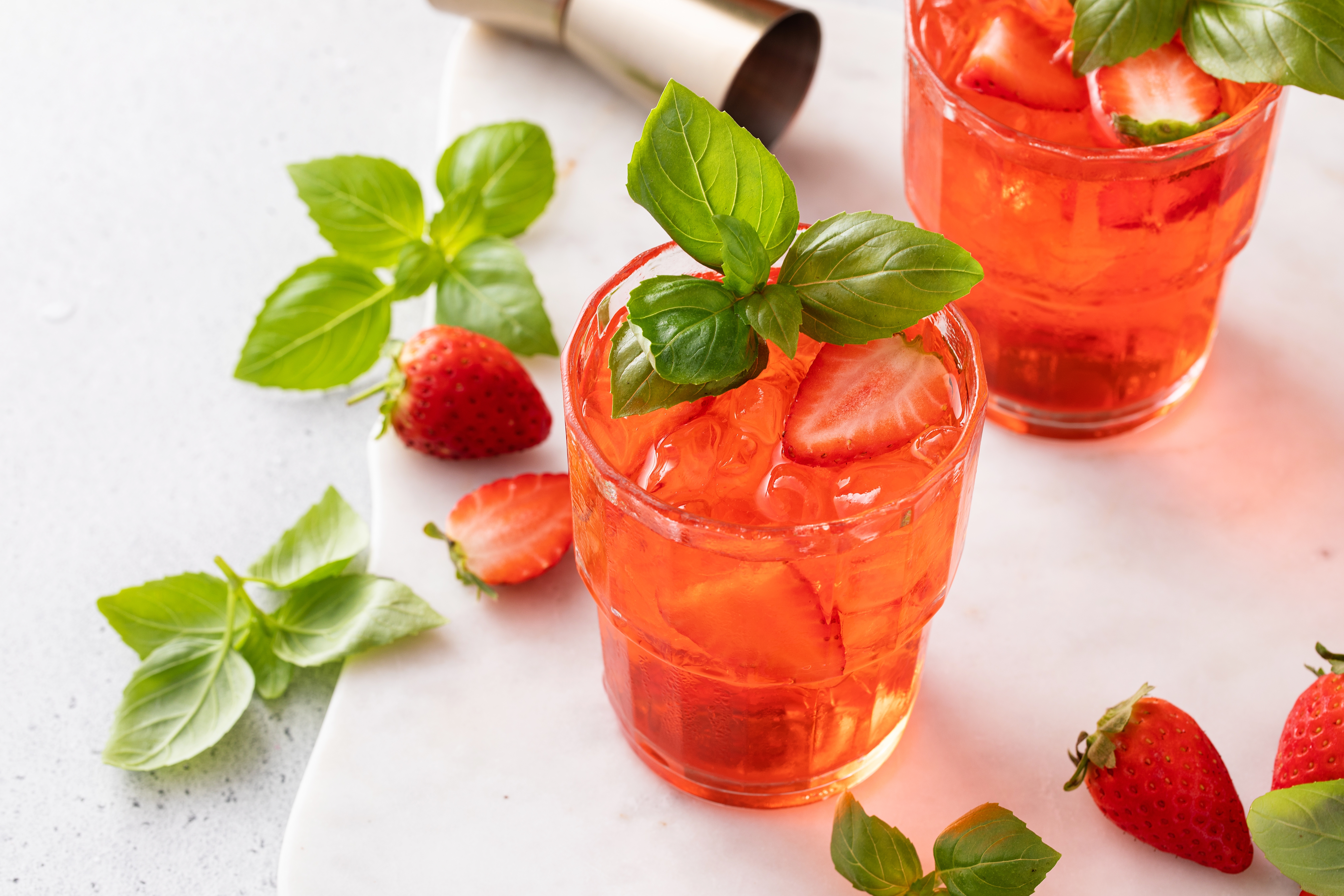 Fruity drinks garnished with strawberries 